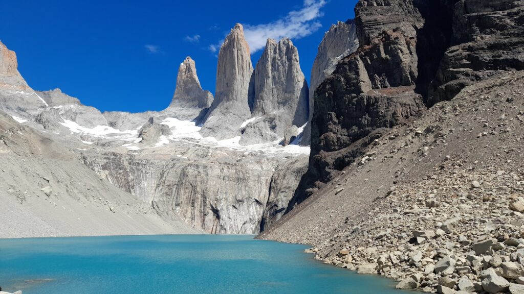 Mountains rise above a glacial lake.